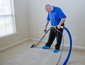 Man cleaning carpet